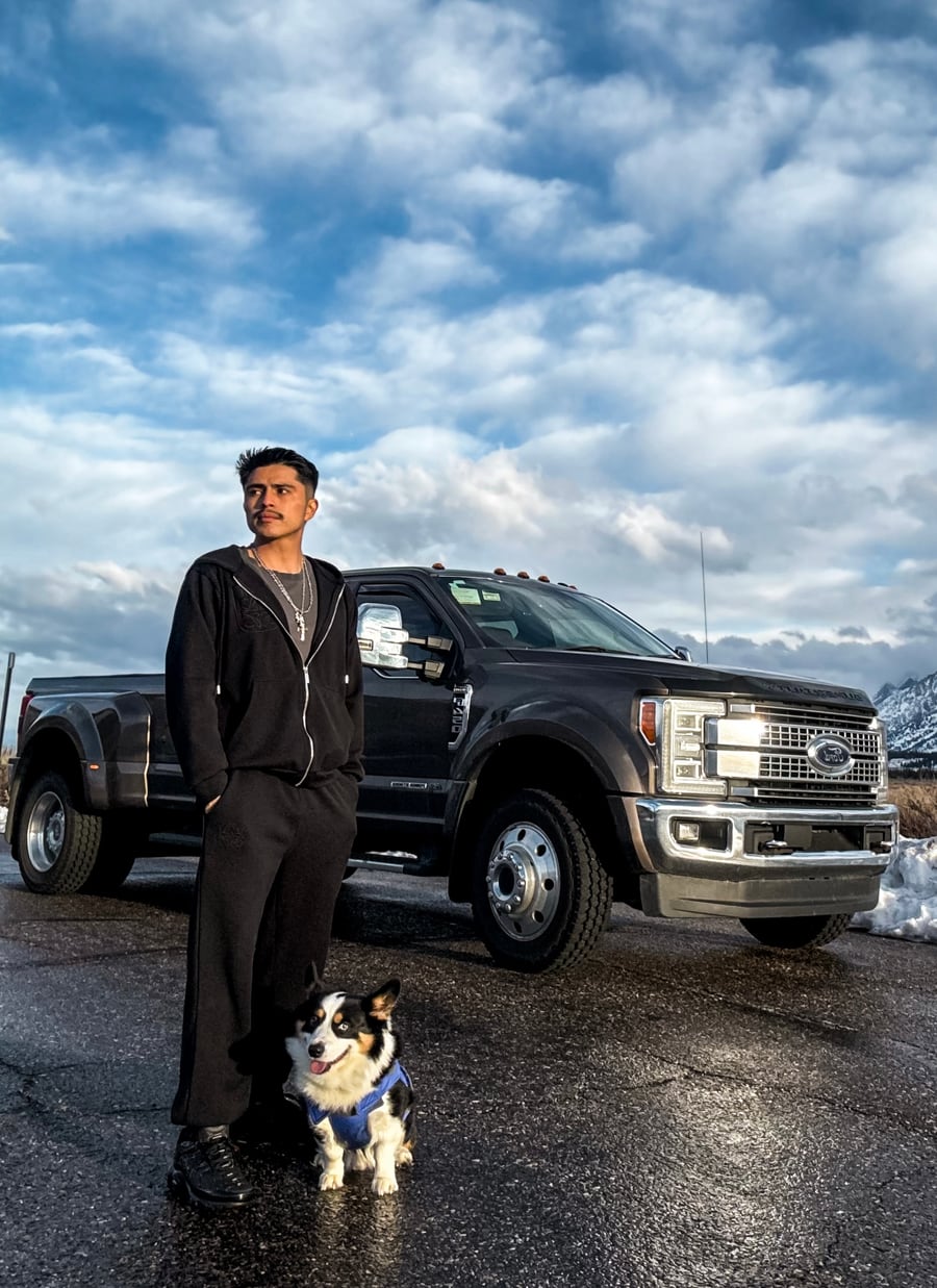 Yancy Garcia with his dog and truck in Jackson, Wyoming